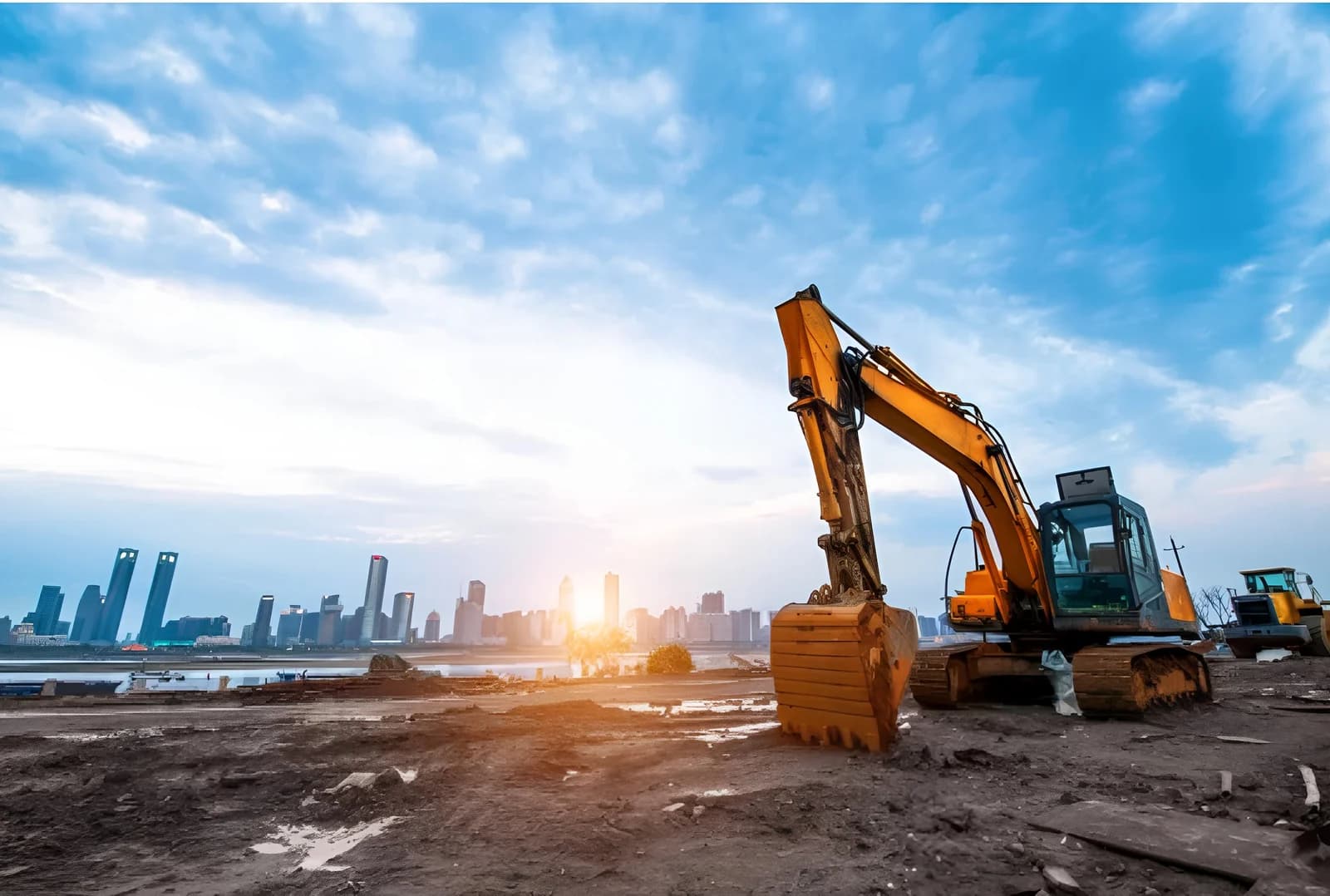 Excavator at work on a Raajlaxmi construction site at sunrise